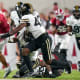 Alabama Crimson Tide wide receiver Jermaine Burton carries the ball against Vanderbilt Commodores after a catch during the first half at Bryant-Denny Stadium.